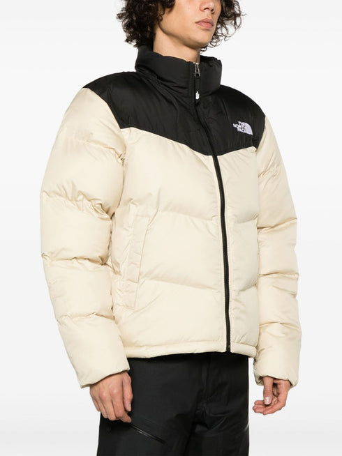 Saikuru logo-embroidered quilted jacket