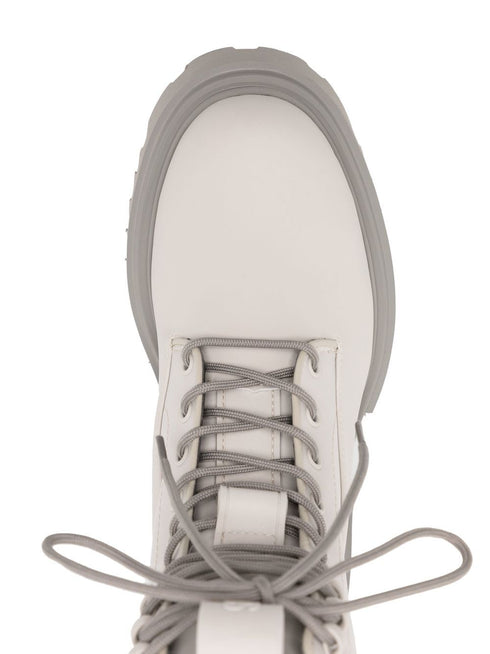 Show lace-up combat boots